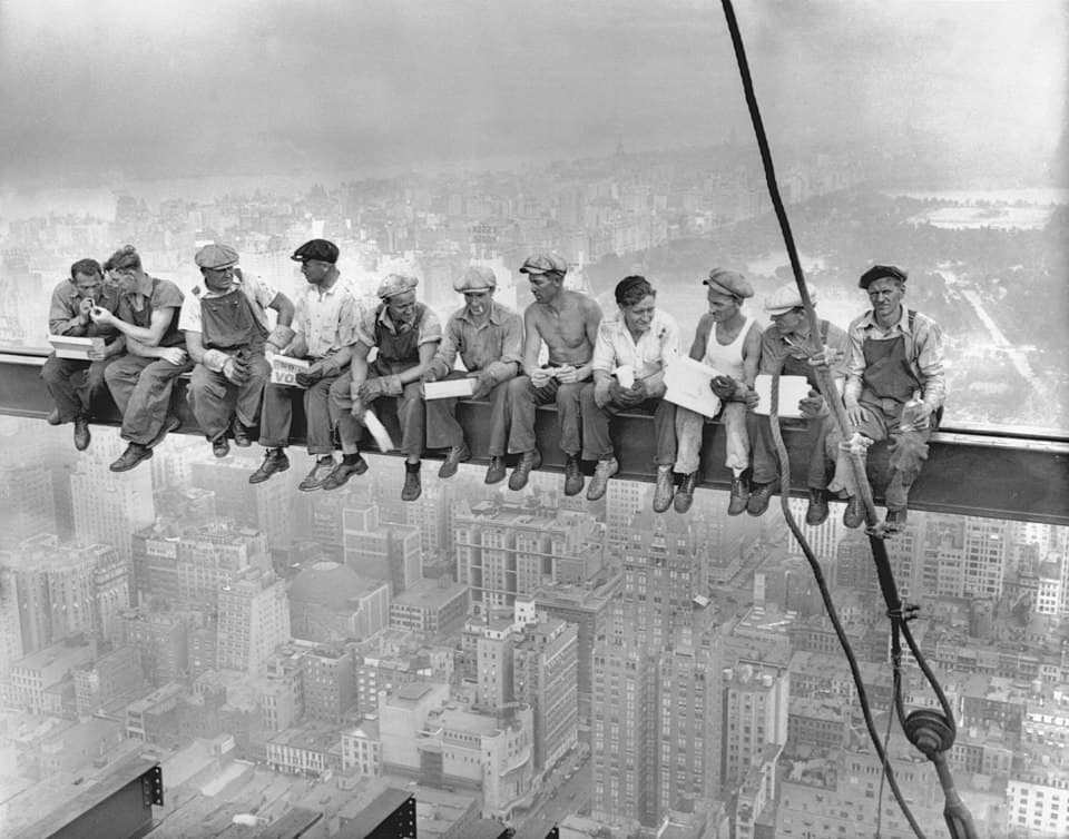 Workers sharing lunch on a skyscraper