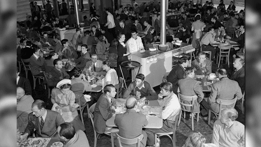 People gathered in a busy cafeteria